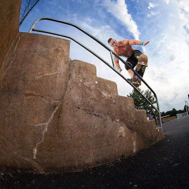 Cena Skates frontside boardslide on a handrail