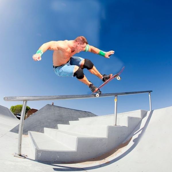 Cena Skates going up a handrail