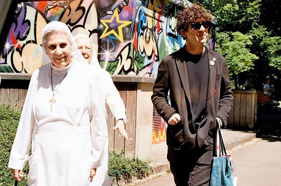 Dustin Dollin with Nuns