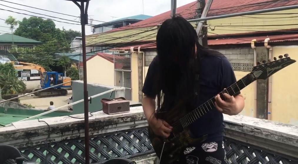 Metalhead shredding a guitar