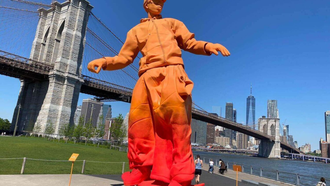 Orange skateboarder statue