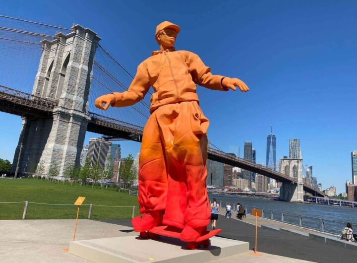 Orange skateboarder statue