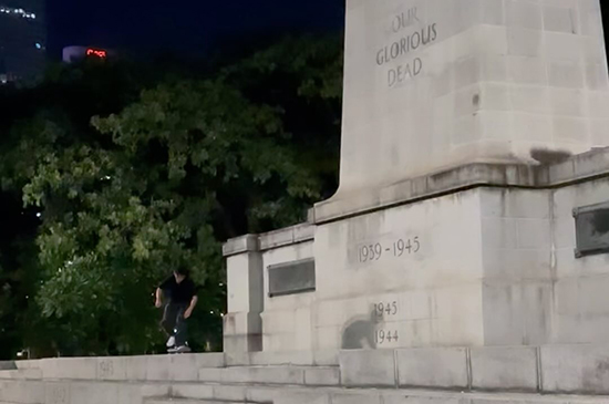 Skateboarder Kickflip on War Memorial