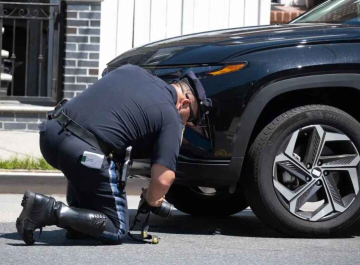 Skateboarder pinned under SUV