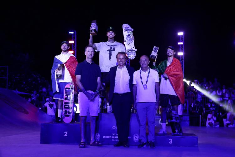 Skateboarding Olympians with corporate executives