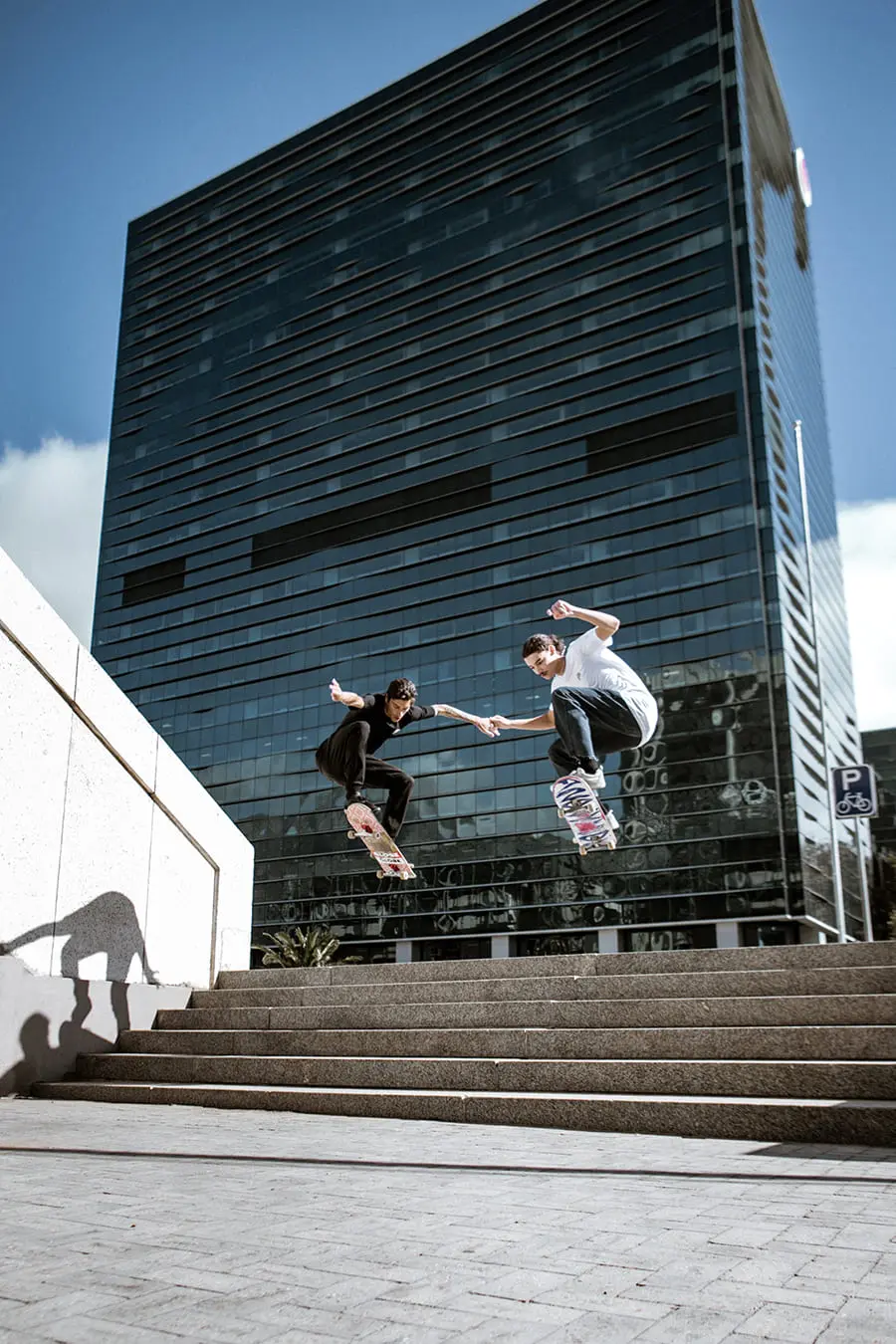 Two skaters Ollieng stairs Two skaters Ollieng stairs